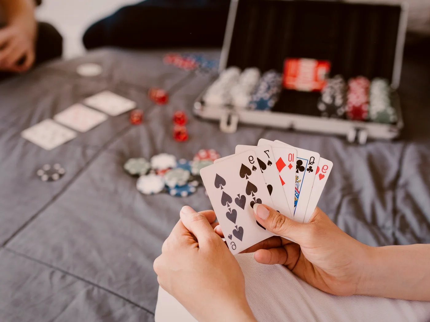 Hands of cards ready to be played